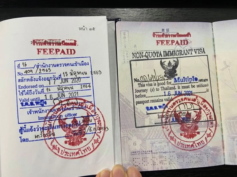 Permanent Residence Permit of the Kingdom of Thailand and Permanent Residence Permit stamp in passport